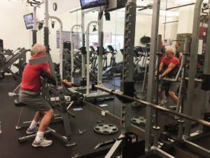 Robert toning muscle at X3 Sports