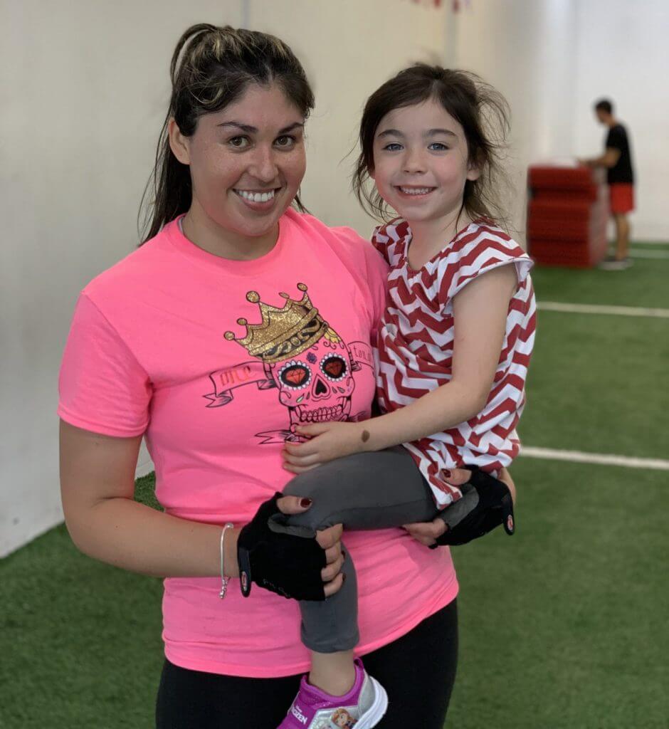Aracely hanging out with her daughter after a Fast Track bootcamp class at X3 Sports North Marietta location.